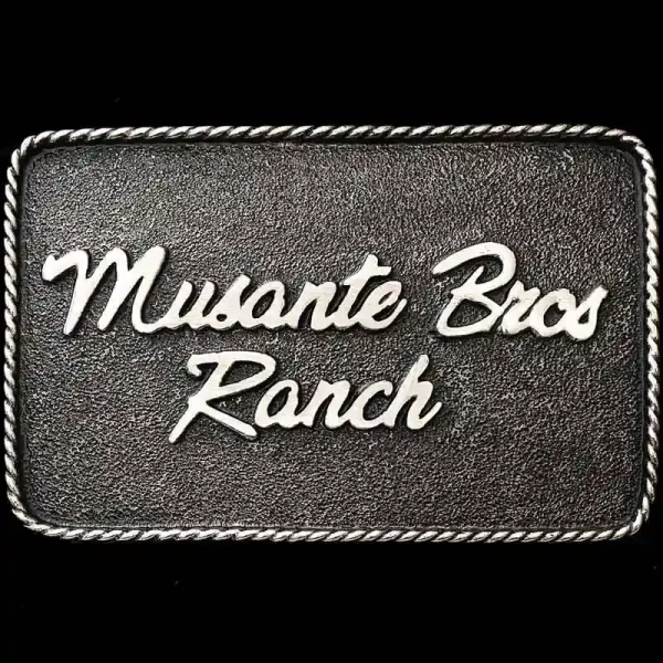 The Huntington Custom Buckle is perfect for adding personalized lettering like your Name, Company Logo, or Ranch Brand. The simple matted, German Silver base with our signature antique finish is a fantastic base for your customizations.